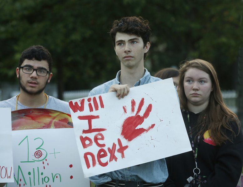 Andover vigil protests gun massacres, bigotry